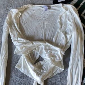 White long sleeve cross top from fashion nova